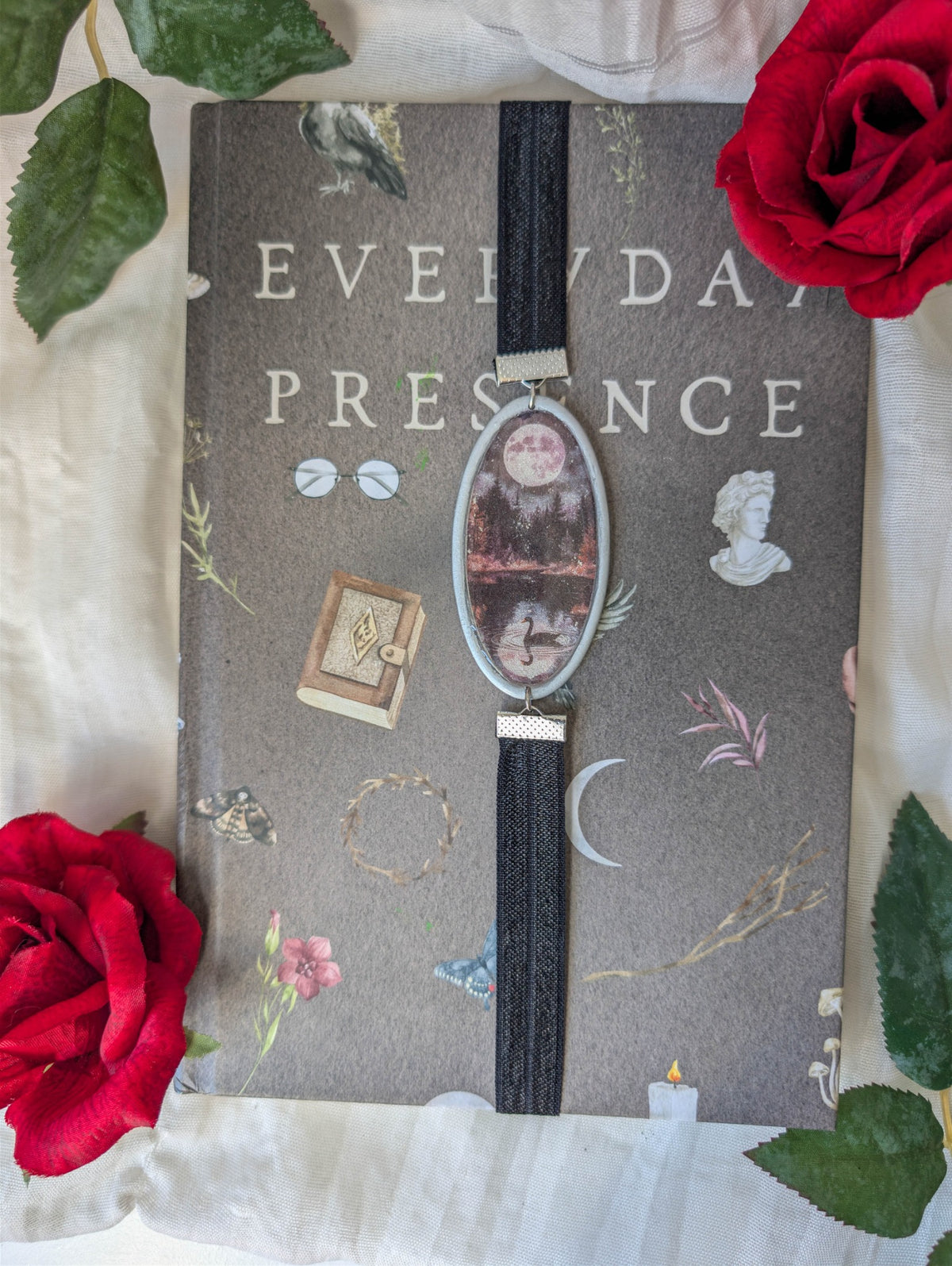Silver moonlit swan lake polymer clay wrap-around bookmark styled on a gothic book with red roses