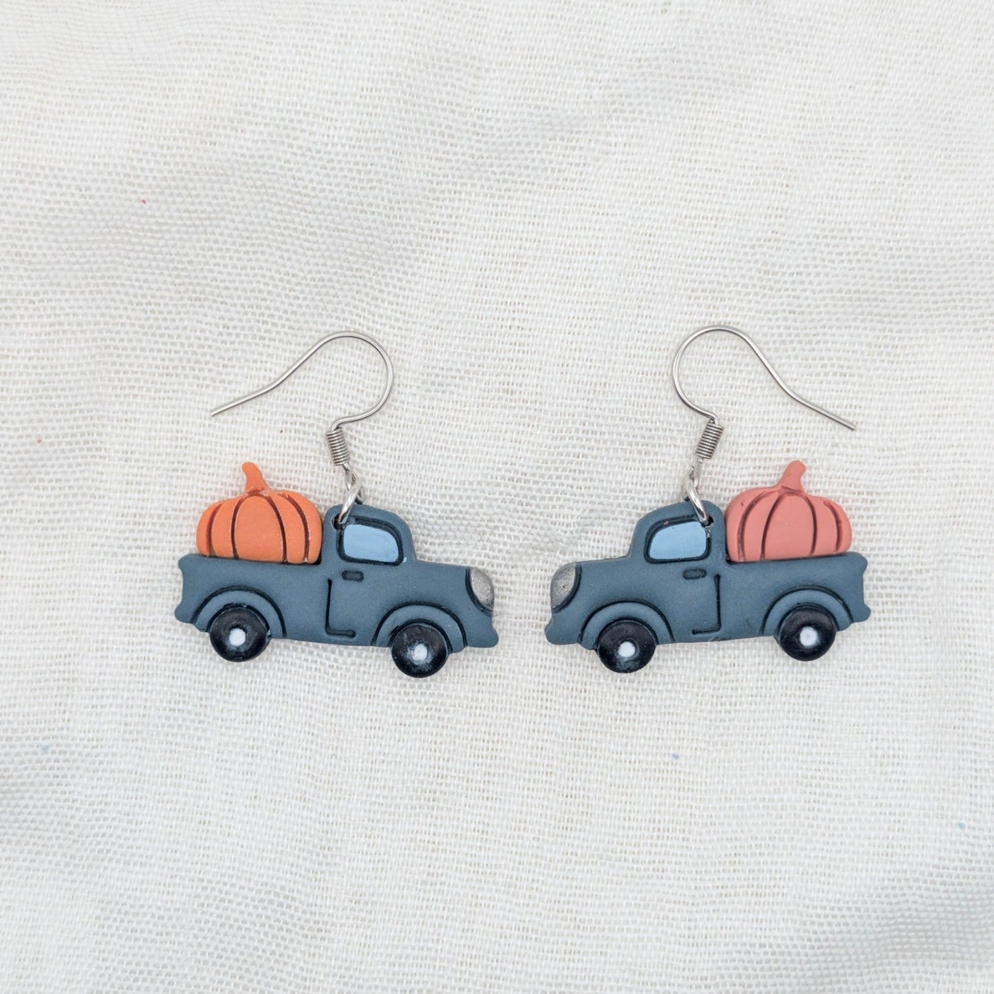 Slate blue pumpkin truck earrings with orange and coral pumpkins and stainless steel hooks