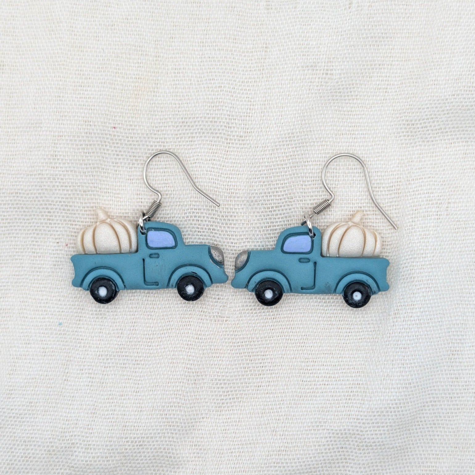 Teal vintage truck earrings with pearly cream pumpkins and surgical-grade stainless steel hooks