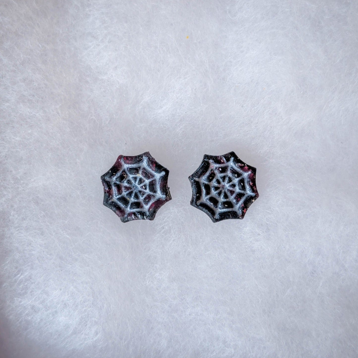 Crimson and black vampire marble cobweb stud earrings with silver web details