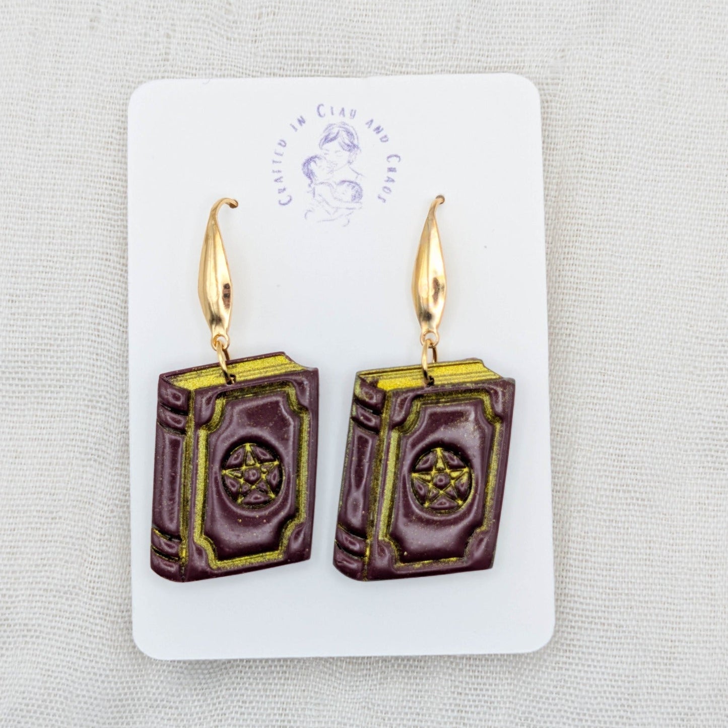 Handmade burgundy witchy spellbook earrings with gold hooks