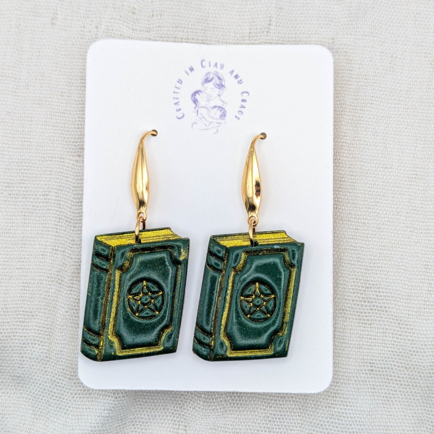 Handmade forest green witchy spellbook earrings with gold hooks