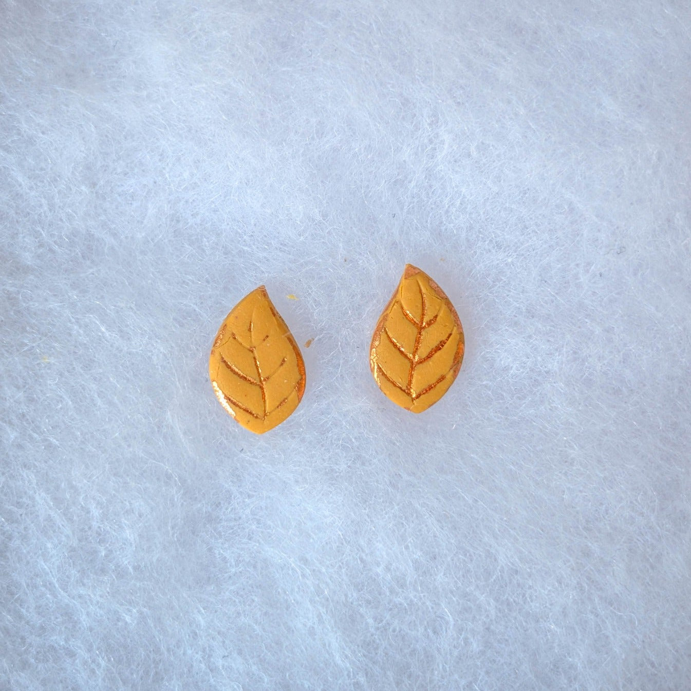 Yellow autumn leaf stud earrings with delicate copper veins and edging